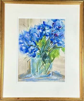 Watercolor painting of blue hydrangeas in gilded frame